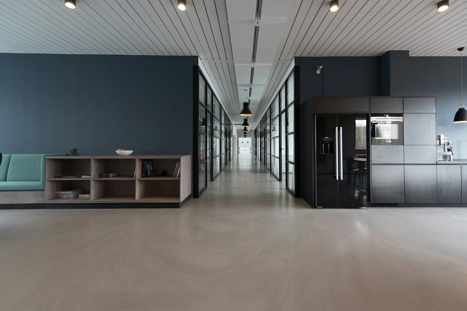 Bright, spotless office space with tidy shelving after professional cleaning